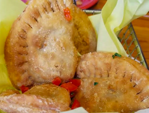 Cafe Tu Tu Tango signature dishes Chipotle Chicken Empanadas
Cuban Filet Mignon Skewers
Spanish Paella